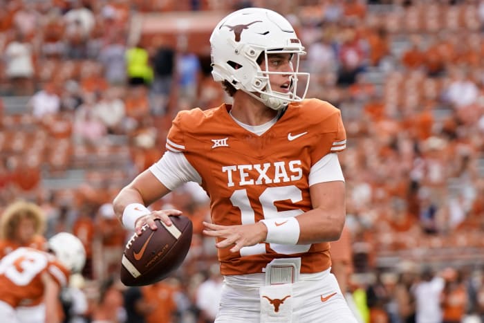 Texas Longhorns quarterback Arch Manning (16) warms up before a game against the Wyoming Cowboys at Darrell K Royal-Texas Memorial Stadium. 